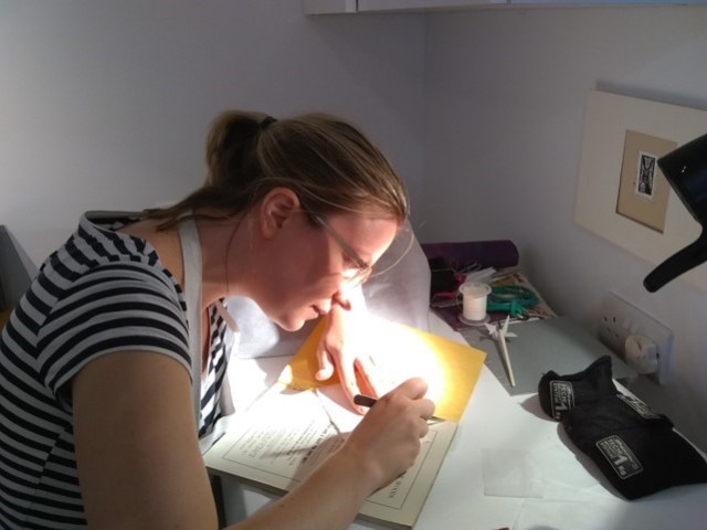 Reducing a heavy layer of animal glue on one booklet