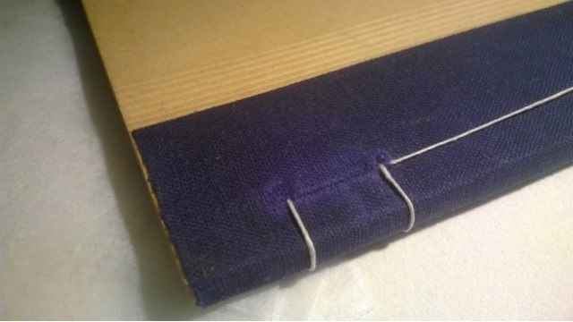 A booklet sewn together after removing staples